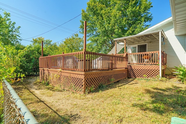 wooden deck with a yard