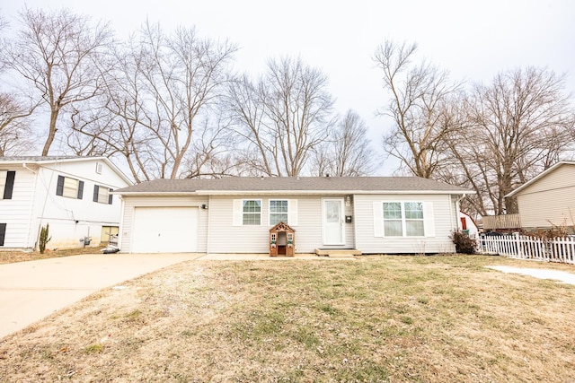 view of front facade featuring a garage and a front lawn