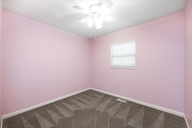 spare room with ceiling fan and carpet flooring