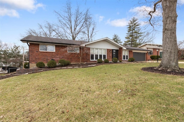 ranch-style house featuring a garage and a front lawn