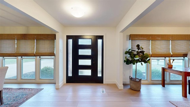 foyer entrance featuring light wood-type flooring