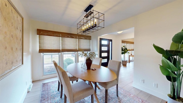 dining area featuring a notable chandelier