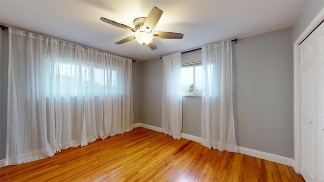 unfurnished room with ceiling fan and light hardwood / wood-style floors