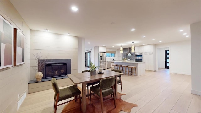 dining space featuring light hardwood / wood-style floors