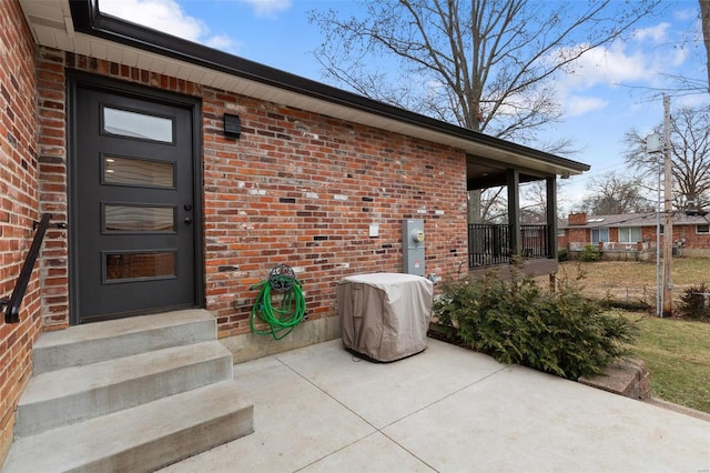 property entrance with a patio