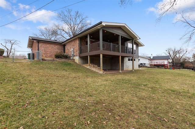 back of property featuring a lawn