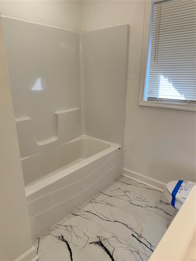 bathroom with washtub / shower combination