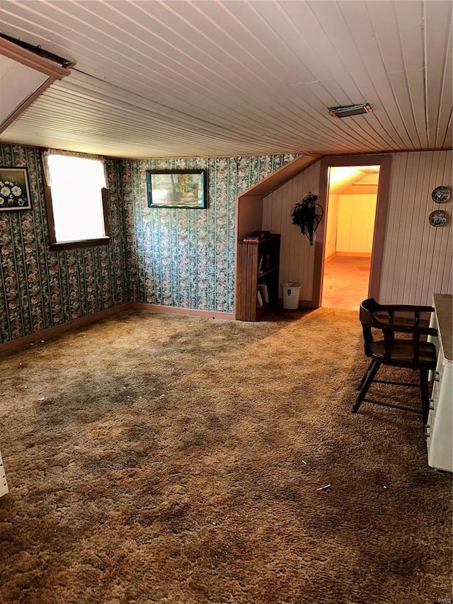 interior space with carpet and wood ceiling