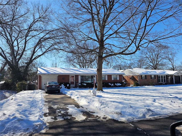 ranch-style house featuring a garage