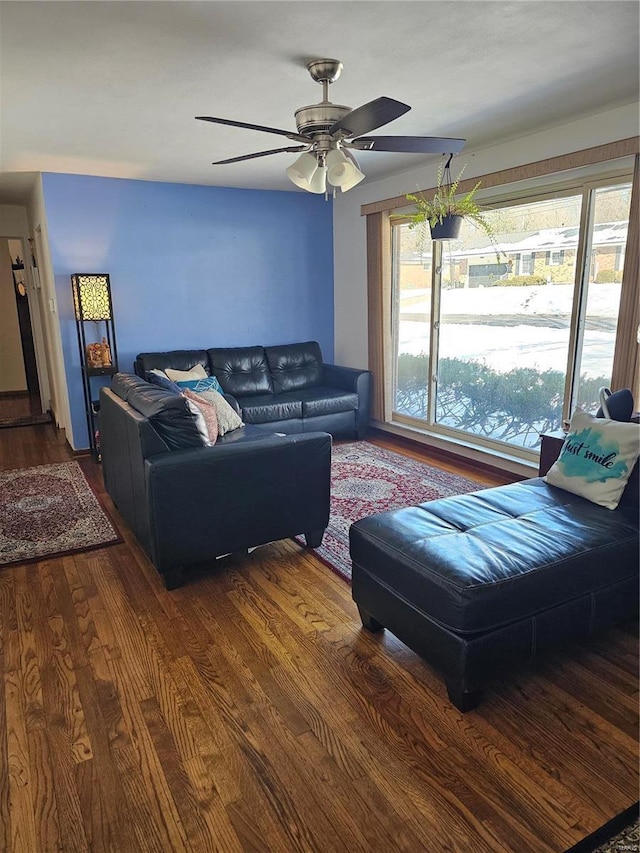 living room featuring hardwood / wood-style flooring and ceiling fan