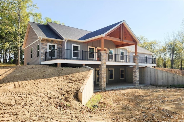 rear view of property with a wooden deck