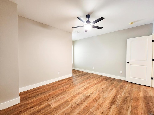 spare room featuring ceiling fan and light hardwood / wood-style floors