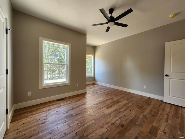 spare room with ceiling fan and light hardwood / wood-style flooring