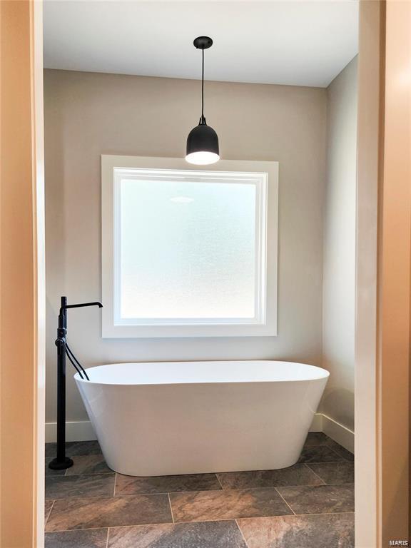 bathroom with a bathing tub