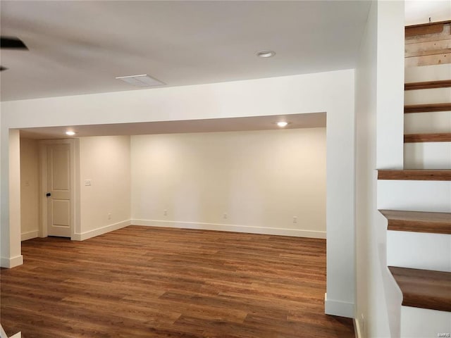 basement featuring dark wood-type flooring