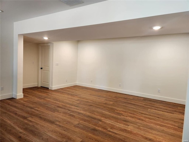 basement featuring dark wood-type flooring