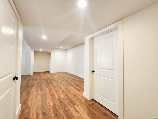 basement featuring light wood-type flooring