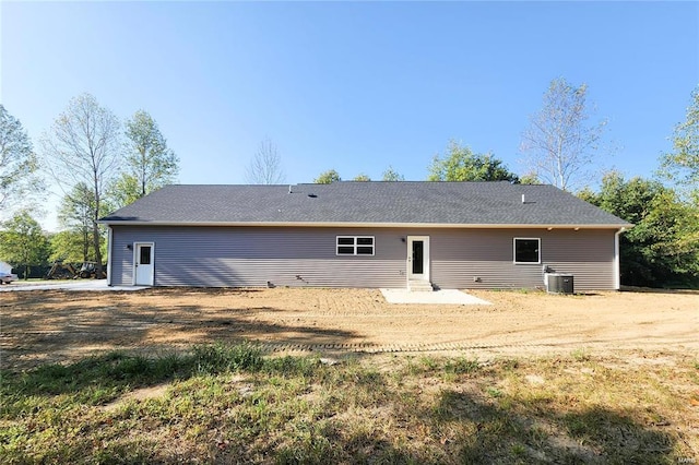 rear view of house with central air condition unit