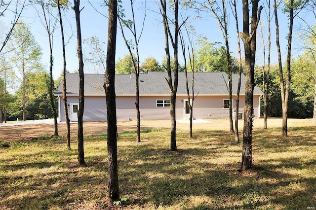 view of home's exterior with a yard