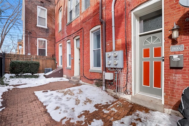 view of snow covered property entrance