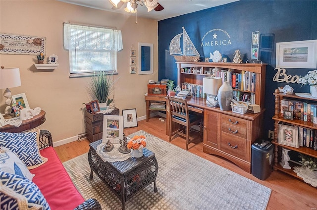 office area with ceiling fan and light hardwood / wood-style floors