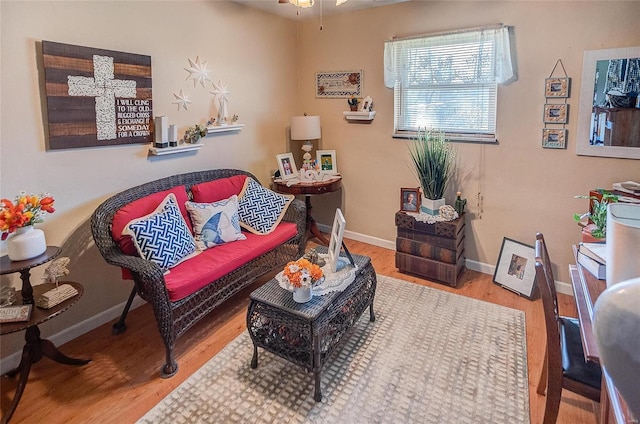 living area with hardwood / wood-style floors