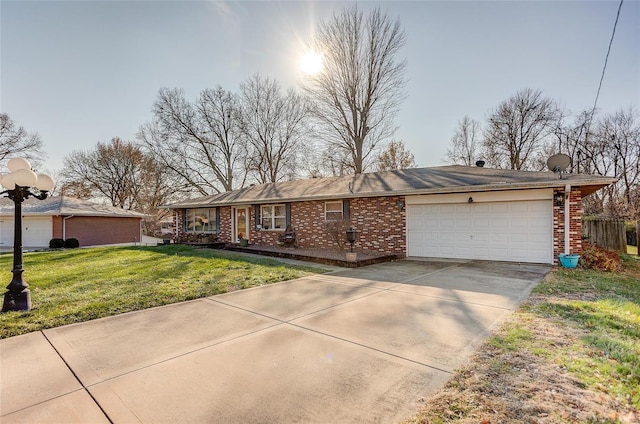 ranch-style home with a front yard and a garage