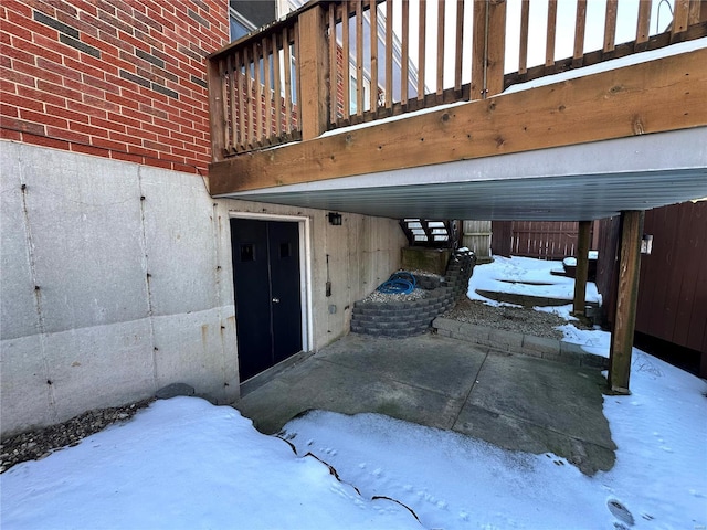 view of snow covered property entrance