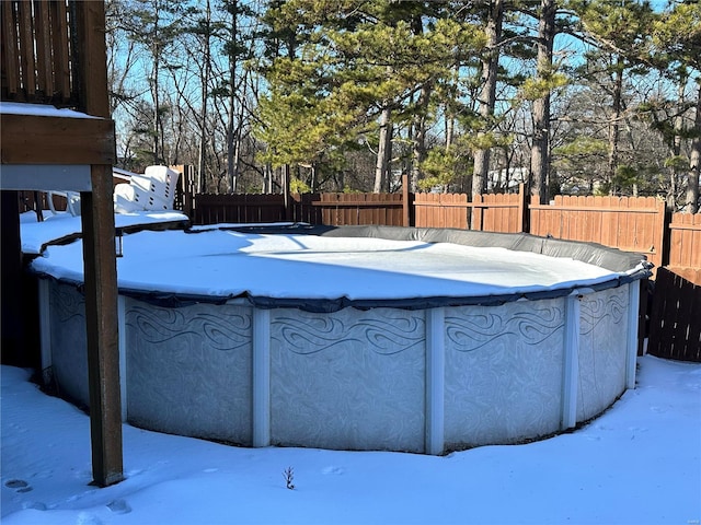 view of snow covered pool