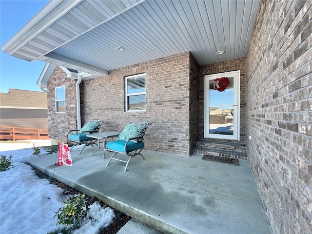 view of snow covered patio