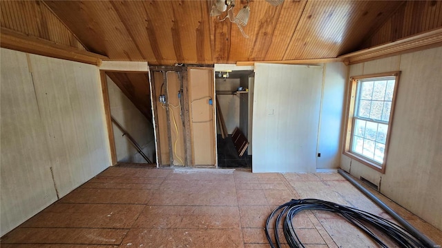 empty room with wood ceiling and lofted ceiling