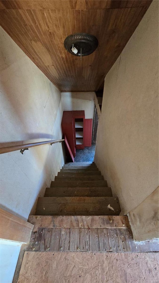 staircase with wooden ceiling