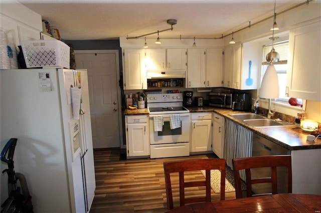 kitchen with white appliances, pendant lighting, dark hardwood / wood-style floors, white cabinets, and sink