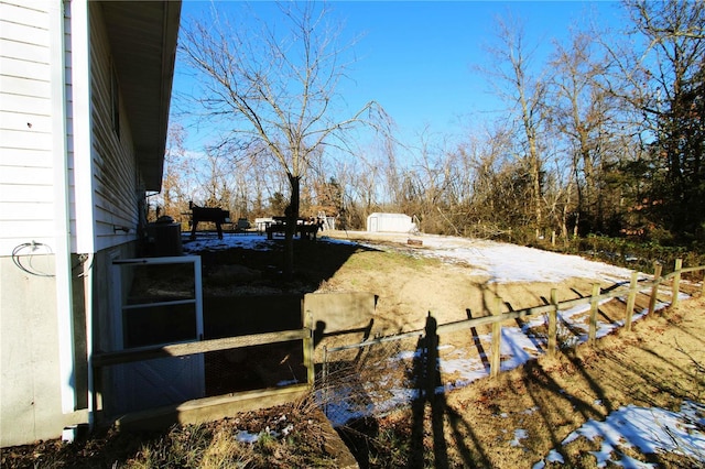 view of yard covered in snow