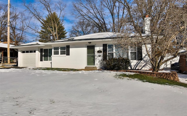 ranch-style home featuring a garage