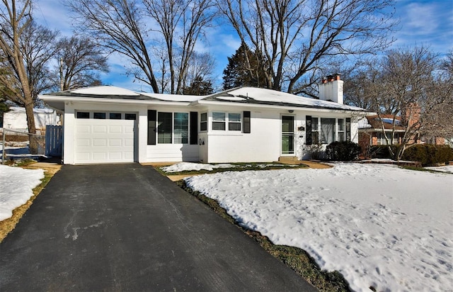 single story home featuring a garage