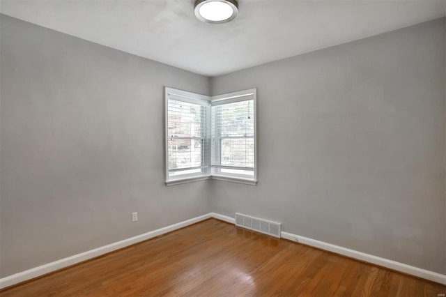 spare room with light hardwood / wood-style floors