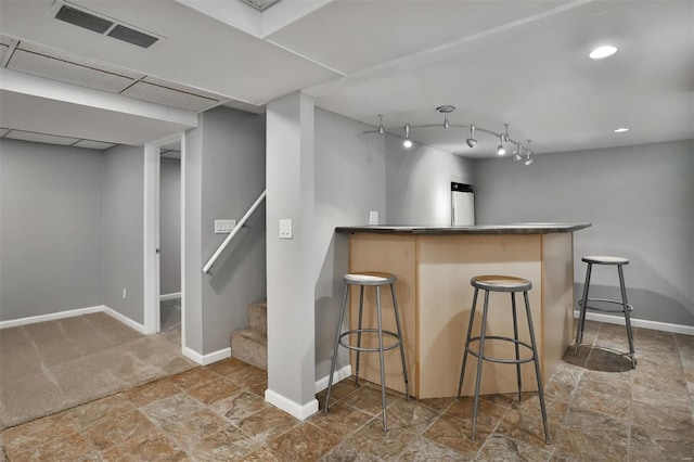 kitchen featuring a breakfast bar and track lighting