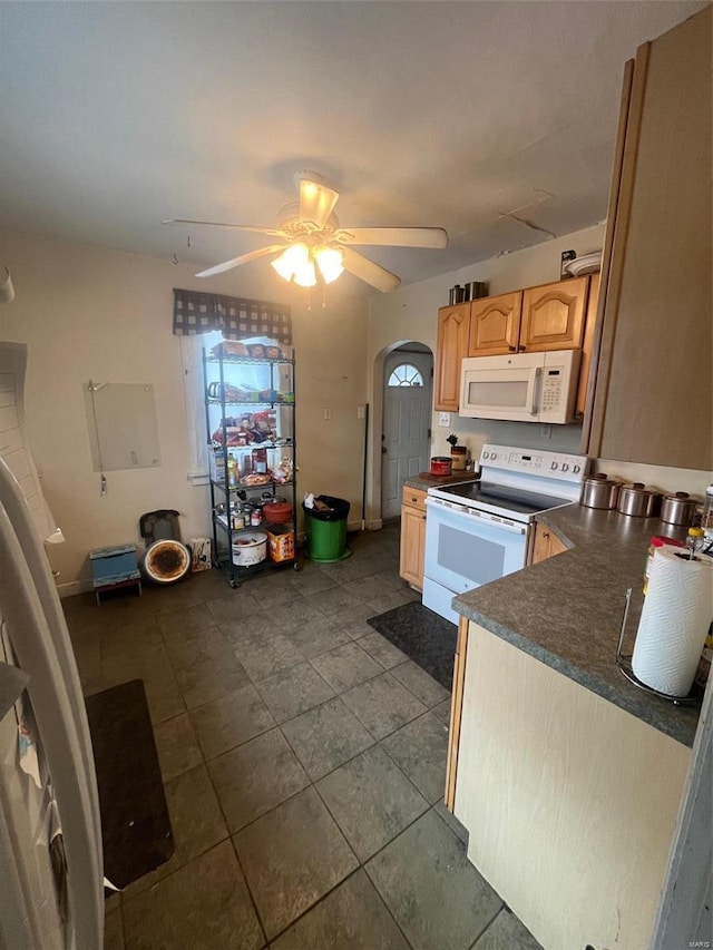 kitchen with ceiling fan, white appliances, and light brown cabinetry