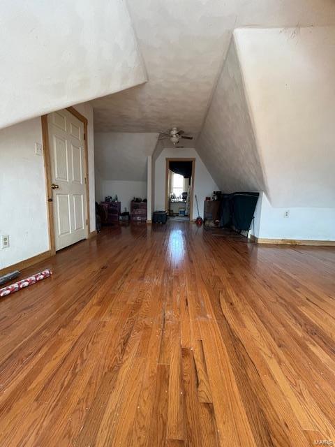 bonus room with ceiling fan, hardwood / wood-style floors, and lofted ceiling