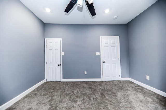 carpeted empty room with ceiling fan