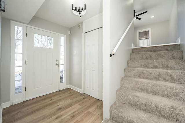 foyer with ceiling fan and hardwood / wood-style floors