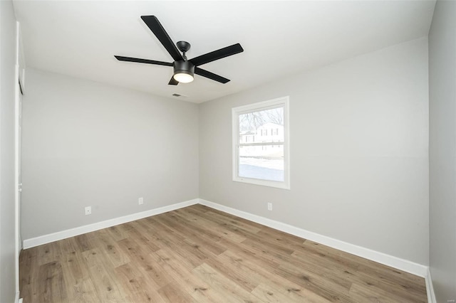 spare room featuring light hardwood / wood-style floors