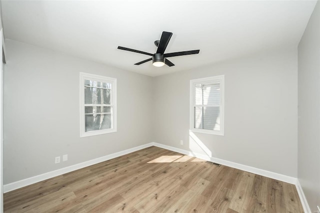 unfurnished room featuring ceiling fan and light hardwood / wood-style floors