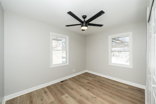 unfurnished room with ceiling fan and light hardwood / wood-style flooring