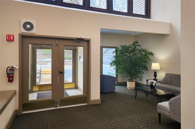 doorway to outside featuring dark carpet and french doors