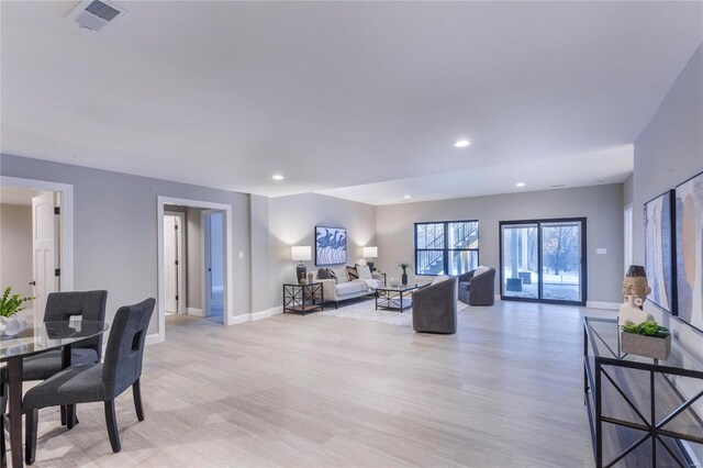 living room with light hardwood / wood-style floors