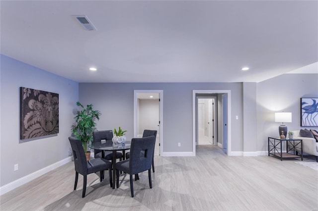 dining room with light hardwood / wood-style floors