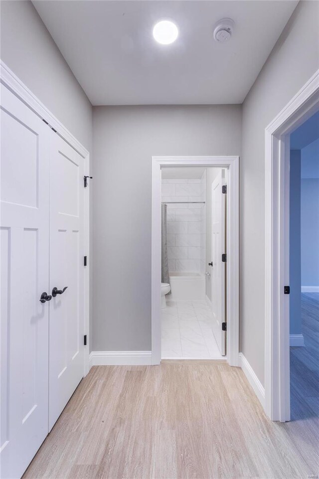 hallway featuring light hardwood / wood-style flooring