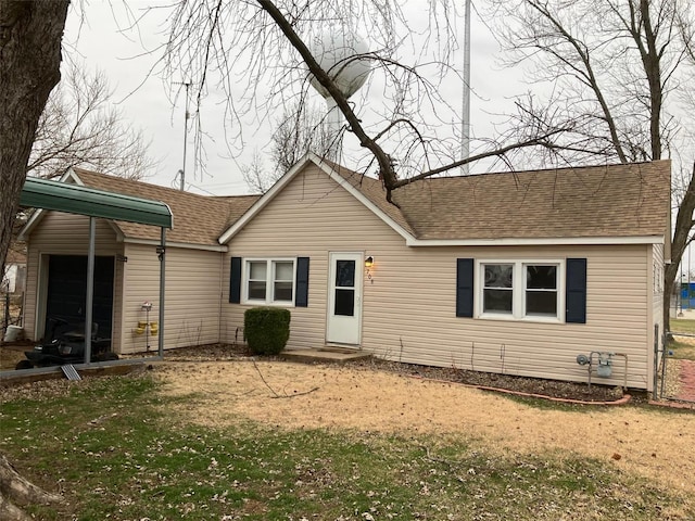 view of front of house with a garage and a front lawn